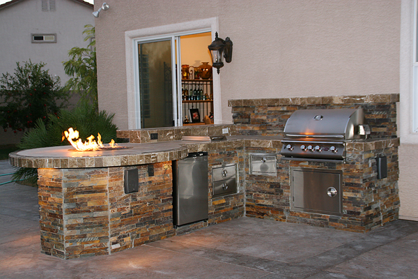 Custom Outdoor Kitchen Design with Social Area and Fire